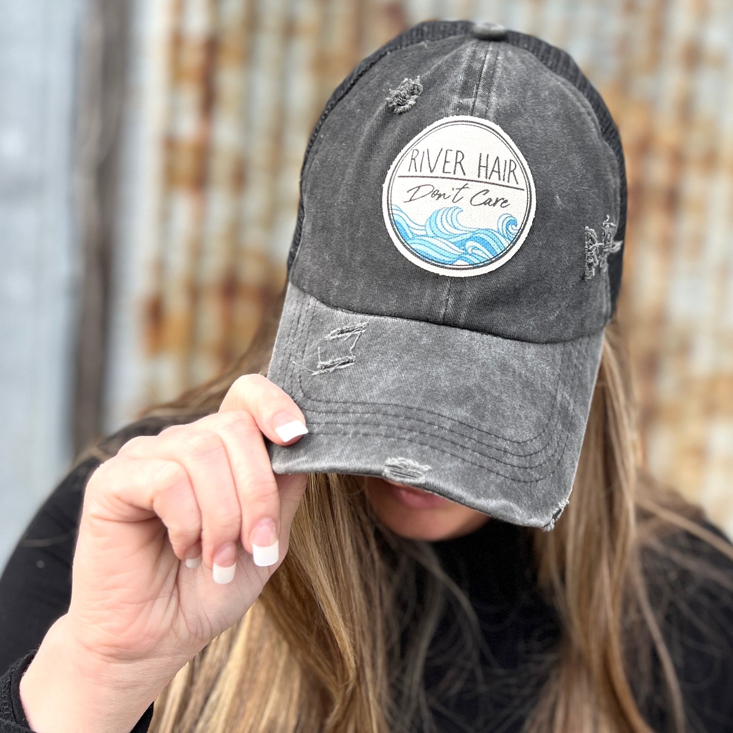 Black Distressed womens cap with material patch saying "river hair dont care"