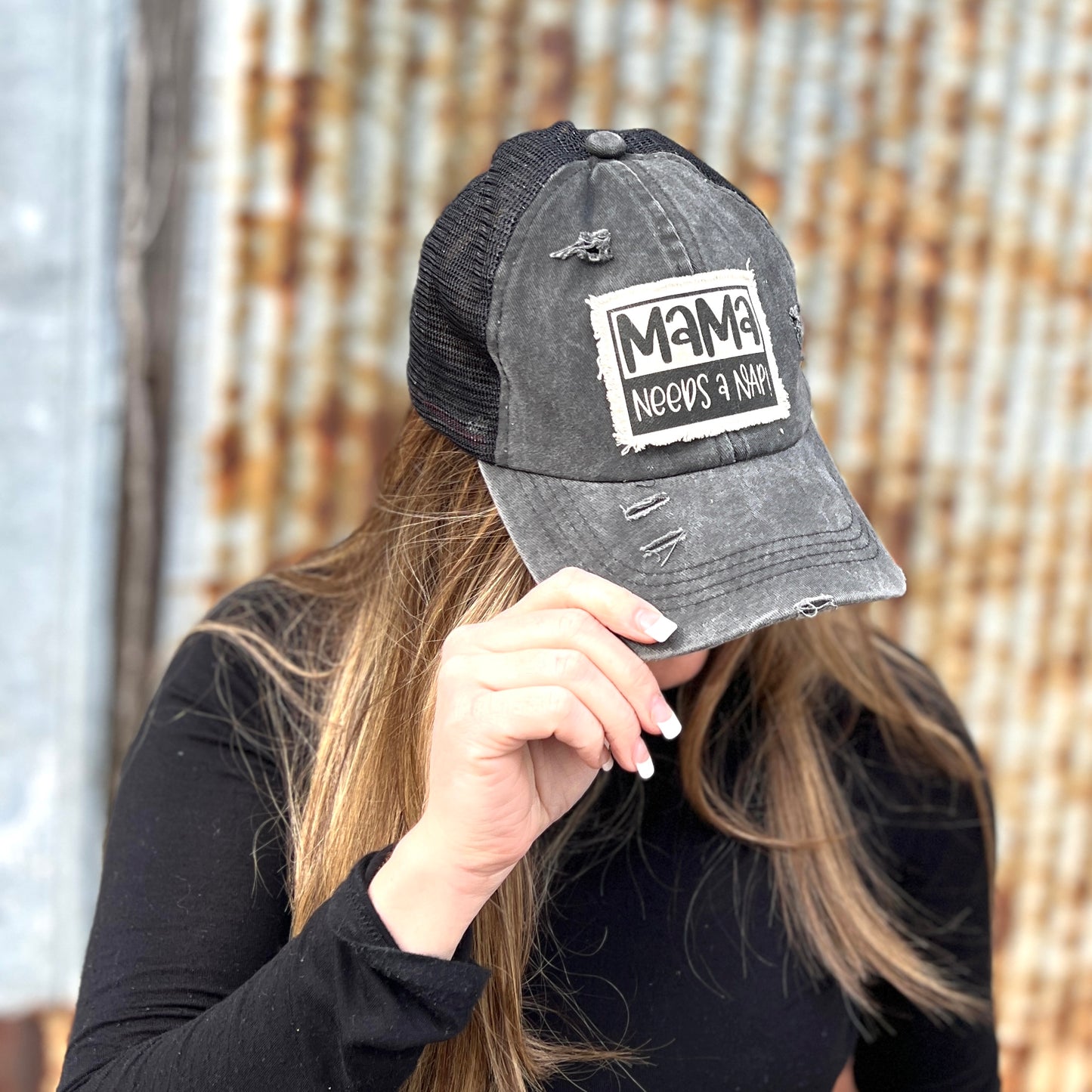 Black baseball cap with material patch saying" Mama needs a nap"