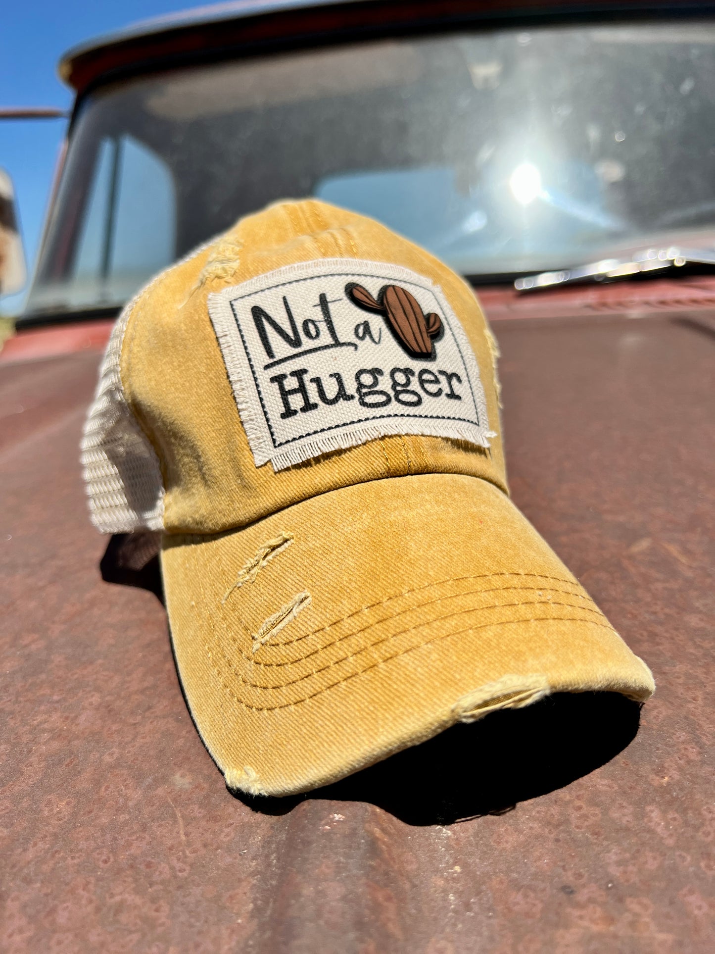 Not a Hugger Mustard Baseball Cap