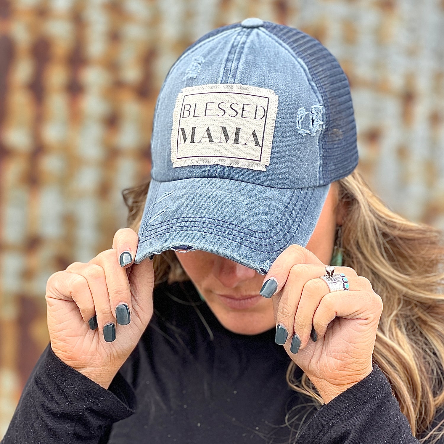 Blessed Mama material patch on distressed navy baseball cap.