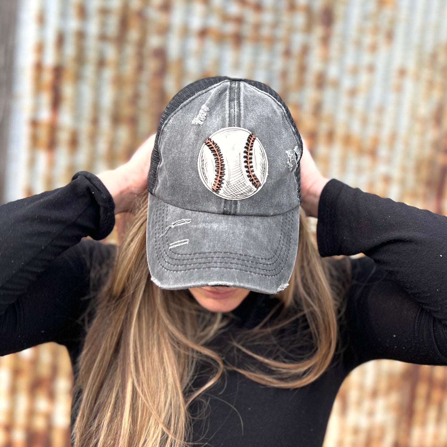 Distressed Black Baseball Cap with Material baseball with leather laces patch. Ponytail back