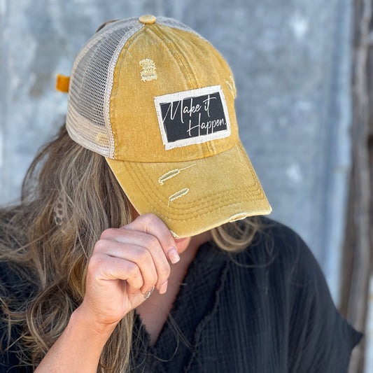 Distressed womens baseball cap with material patch saying "Make It Happen"
