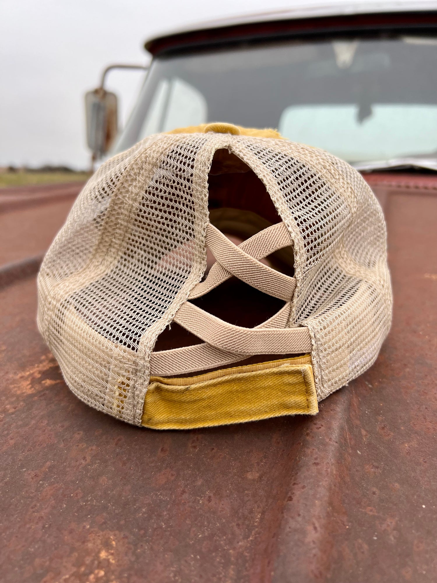 Criss Cross back of mustard distressed womens baseball cap 