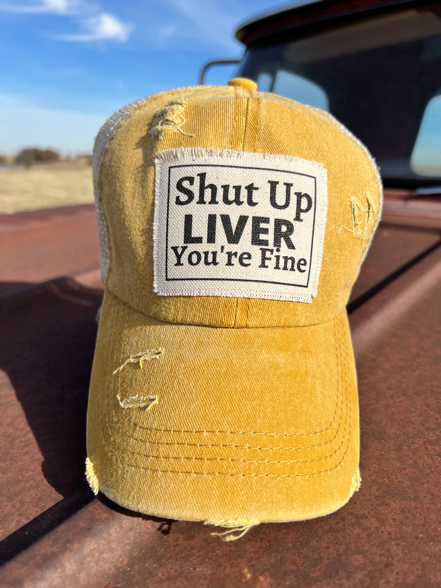 Mustard Baseball cap with material patch saying "Shut Up Liver Your Fine" 
